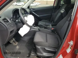 2015 Mazda CX-5 Sport with VIN JM3KE4BY9F0479748, listed as a Copart auction lot 58847805 with 122,698 mi miles and Salvage title. Bid and sale history available at DreamBid. Image 7.