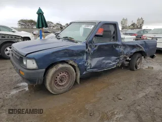 1992 Toyota Pickup z VIN JT4RN81A8N0099916, wystawiony jako Copart lot #44650015 z przebiegiem 256 103 mil mil oraz Szkoda całkowita • Salvage title. Historia ofert i sprzedaży dostępna na DreamBid. Obrazek 1.