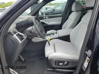 2024 BMW X5 M60i with VIN 5UX33EU08R9W18668, listed as a Copart auction lot 51631284 with 875 mi miles and Salvage Title. Bid and sale history available at carsss.com. Image 7.