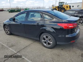 2018 Ford Focus SE with VIN 1FADP3FEXJL215912, listed as a Copart auction lot 50518385 with 100,080 mi miles and Salvage Title. Bid and sale history available at carsss.com. Image 2.