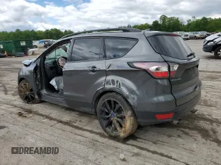 2017 Ford Escape SE z VIN 1FMCU9GD7HUB76204, wystawiony jako Copart lot #58334725 z przebiegiem Nie podano mil oraz Szkoda całkowita • Salvage title. Historia ofert i sprzedaży dostępna na DreamBid. Obrazek 2.