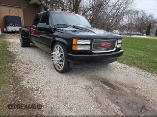 1997 GMC Sierra 3500 z VIN 1GTHC33J5VF005375, wystawiony jako IAAI lot #42298688 z przebiegiem 188 825 mil mil oraz . Historia ofert i sprzedaży dostępna na DreamBid. Obrazek 1.