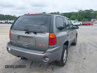 2007 GMC Envoy SLE with VIN 1GKDS13S572174308, listed as a IAAI auction lot 42211372 with 212,377 mi miles and . Bid and sale history available at DreamBid. Image 4.