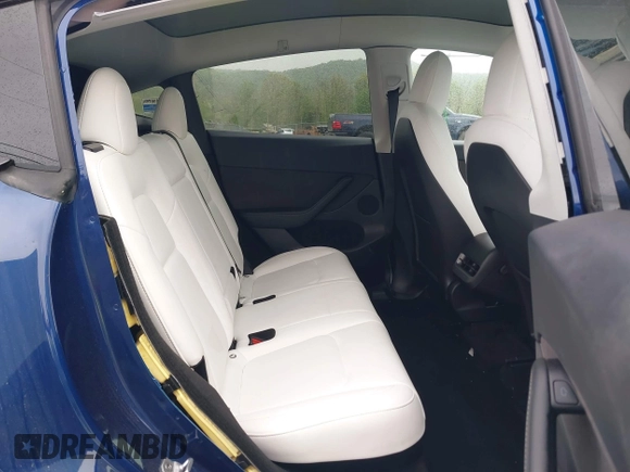 2023 Tesla Model Y Long Range z VIN 7SAYGDEE6PF603981, wystawiony jako IAAI lot #42133348 z przebiegiem 28 566 mil mil oraz . Historia ofert i sprzedaży dostępna na DreamBid. Obrazek 8.