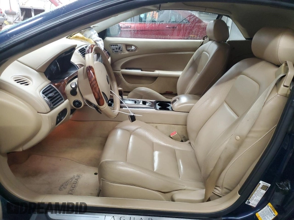 2007 Jaguar XK with VIN SAJDA44BX75B00447, listed as a Copart auction lot 50147695 with 119,467 mi miles and Salvage Title. Bid and sale history available at carsss.com. Image 7.