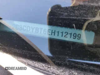 2014 Dodge Challenger R/T z VIN 2C3CDYBT6EH112199, wystawiony jako Copart lot #58023535 z przebiegiem 99 977 mil mil oraz Szkody całkowita. Historia ofert i sprzedaży dostępna na DreamBid. Obrazek 12.