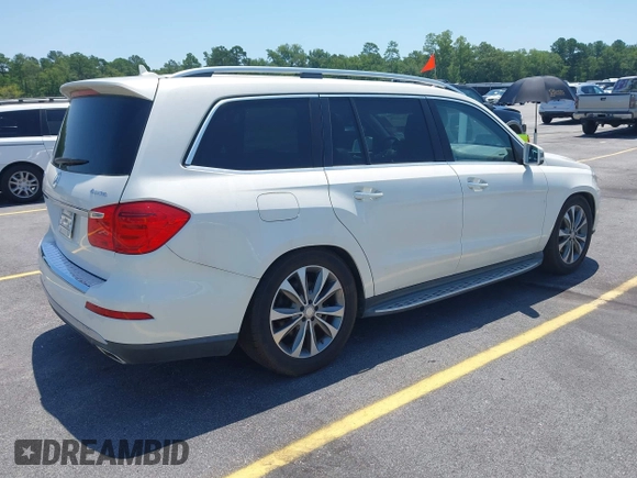2014 Mercedes-Benz GL 450 with VIN 4JGDF7CE4EA348588, listed as a IAAI auction lot 42601136 with 129,166 mi miles and . Bid and sale history available at DreamBid. Image 4.