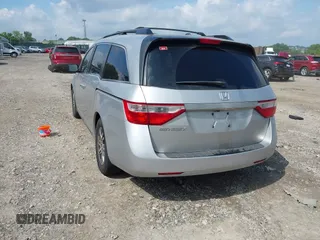 2012 Honda Odyssey EX-L with VIN 5FNRL5H61CB081634, listed as a IAAI auction lot 42760909 with 197,949 mi miles and . Bid and sale history available at DreamBid. Image 3.