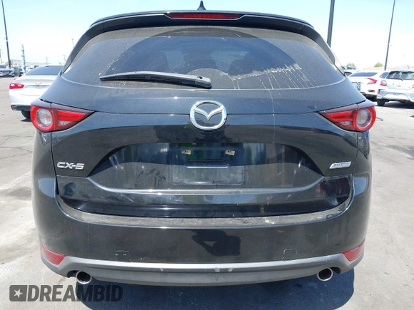 2018 Mazda CX-5 Grand Touring z VIN JM3KFADM7J0327272, wystawiony jako IAAI lot #42279536 z przebiegiem 97 478 mil mil oraz . Historia ofert i sprzedaży dostępna na DreamBid. Obrazek 16.