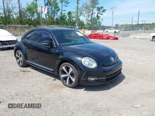 2012 Volkswagen Beetle 2.0T Turbo w/Sun/Snd/Nav PZEV with VIN 3VWVA7AT6CM659395, listed as a IAAI auction lot 41910321 with 132,114 mi miles. Bid and sale history available at carsss.com. Image 1.