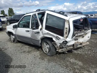 1994 Jeep Grand Cherokee Laredo with VIN 1J4GZ58Y2RC207099, listed as a Copart auction lot 71176114 with 127,110 mi miles and Salvage Title. Bid and sale history available at carsss.com. Image 2.