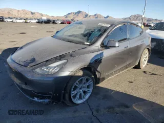 2021 Tesla Model Y Standard Range with VIN 5YJYGDED4MF174002, listed as a Copart auction lot 88878785 with 25,894 mi miles and Salvage Title. Bid and sale history available at carsss.com. Image 1.