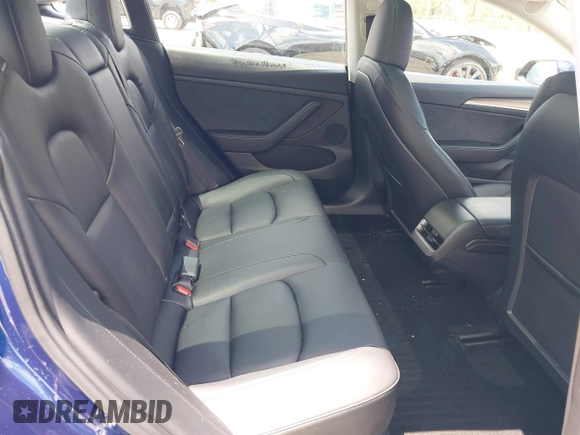 2023 Tesla Model 3 with VIN 5YJ3E1EA0PF658080, listed as a IAAI auction lot 42008846 with 32,301 mi miles and . Bid and sale history available at carsss.com. Image 8.
