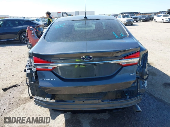 2017 Ford Fusion SE z VIN 3FA6P0H79HR412250, wystawiony jako IAAI lot #41984265 z przebiegiem 108 106 mil mil oraz . Historia ofert i sprzedaży dostępna na DreamBid. Obrazek 16.