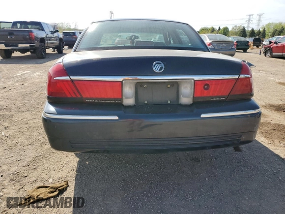 1999 Mercury Grand Marquis LS z VIN 2MEFM75W1XX635839, wystawiony jako Copart lot #55860735 z przebiegiem 114 963 mil mil oraz Szkoda całkowita • Salvage title. Historia ofert i sprzedaży dostępna na DreamBid. Obrazek 6.