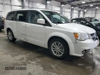 2014 Dodge Grand Caravan SXT with VIN 2C4RDGCG6ER427435, listed as a Copart auction lot 51957355 with 106,078 mi miles and Salvage Title. Bid and sale history available at DreamBid. Image 4.