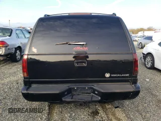 1999 Cadillac Escalade z VIN 1GYEK13R7XR405790, wystawiony jako Copart lot #84478384 z przebiegiem 244 195 mil mil oraz Szkody całkowita. Historia ofert i sprzedaży dostępna na DreamBid. Obrazek 6.