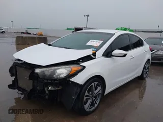 2016 Kia Forte EX with VIN KNAFX4A82G5450616, listed as a IAAI auction lot 42107042 with 131,419 mi miles. Bid and sale history available at carsss.com. Image 2.