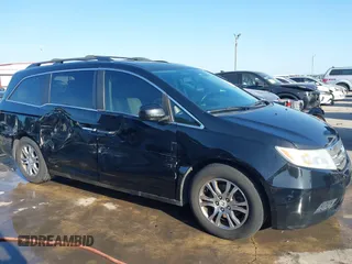 2013 Honda Odyssey EX-L with VIN 5FNRL5H6XDB090768, listed as a IAAI auction lot 42008759 with 116,052 mi miles and . Bid and sale history available at carsss.com. Image 6.