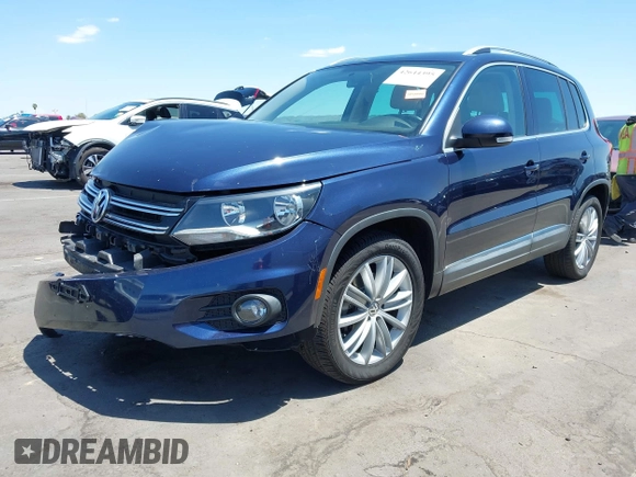 2015 Volkswagen Tiguan SE with VIN WVGAV7AX8FW595806, listed as a IAAI auction lot 42644395 with 51,638 mi miles and . Bid and sale history available at DreamBid. Image 2.