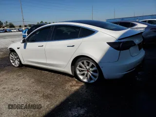 2020 Tesla Model 3 Standard Range Plus with VIN 5YJ3E1EA6LF661513, listed as a Copart auction lot 47008985 with 128,362 mi miles and Non Repairable. Bid and sale history available at DreamBid. Image 2.
