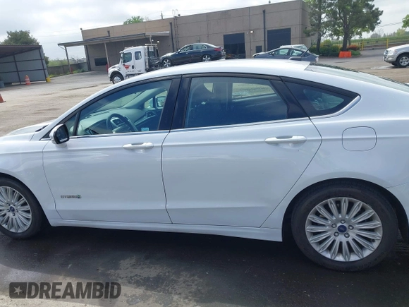 2016 Ford Fusion SE Hybrid with VIN 3FA6P0LU7GR397310, listed as a IAAI auction lot 42075891 with 124,879 mi miles. Bid and sale history available at carsss.com. Image 14.