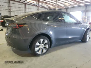 2023 Tesla Model Y Long Range z VIN 7SAYGDEE3PF862038, wystawiony jako Copart lot #57639325 z przebiegiem 11 020 mil mil oraz Szkoda całkowita • Salvage title. Historia ofert i sprzedaży dostępna na DreamBid. Obrazek 3.