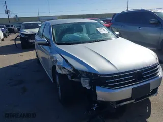 2016 Volkswagen Passat 1.8T S with VIN 1VWAS7A36GC032067, listed as a IAAI auction lot 41207782 with 123,651 mi miles. Bid and sale history available at carsss.com. Image 1.