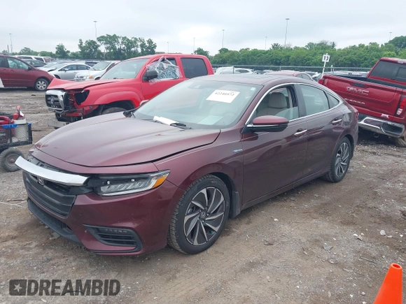 2020 Honda Insight Touring z VIN 19XZE4F93LE010040, wystawiony jako IAAI lot #42240572 z przebiegiem 52 299 mil mil oraz . Historia ofert i sprzedaży dostępna na DreamBid. Obrazek 2.