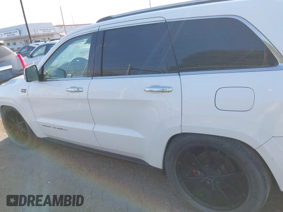 2015 Jeep Grand Cherokee Summit with VIN 1C4RJFJT5FC767687, listed as a IAAI auction lot 42015878 with 1 mi miles. Bid and sale history available at carsss.com. Image 14.