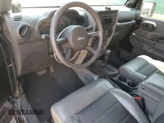 2009 Jeep Wrangler X z VIN 1J4FA24179L716499, wystawiony jako Copart lot #58342675 z przebiegiem 116 871 mil mil oraz Szkoda całkowita • Salvage title. Historia ofert i sprzedaży dostępna na DreamBid. Obrazek 8.