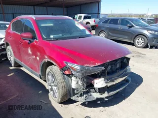 2020 Mazda CX-5 Grand Touring with VIN JM3KFADM3L0761286, listed as a IAAI auction lot 41715379 with 145,656 mi miles and . Bid and sale history available at DreamBid. Image 1.
