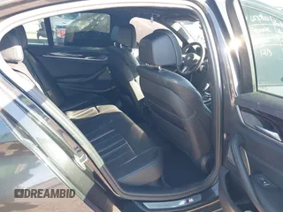 2018 BMW 5 Series M550i xDrive with VIN WBAJB9C57JG463933, listed as a IAAI auction lot 41295711 with 99,173 mi miles and . Bid and sale history available at carsss.com. Image 8.