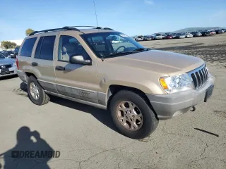 1999 Jeep Grand Cherokee Laredo z VIN 1J4GW58NXXC704719, wystawiony jako Copart lot #49546395 z przebiegiem 276 716 mil mil oraz Czysty tytuł • Clean title. Historia ofert i sprzedaży dostępna na DreamBid. Obrazek 4.