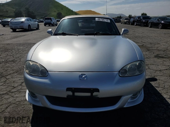 2003 Mazda MX-5 Miata Cloth z VIN JM1NB353430301685, wystawiony jako Copart lot #48756715 z przebiegiem 57 414 mil mil oraz Szkoda całkowita • Salvage title. Historia ofert i sprzedaży dostępna na DreamBid. Obrazek 5.