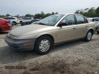 1999 Saturn SL z VIN 1G8ZH5283XZ349797, wystawiony jako Copart lot #58221955 z przebiegiem 148 506 mil mil oraz Nie do naprawy. Historia ofert i sprzedaży dostępna na DreamBid. Obrazek 1.