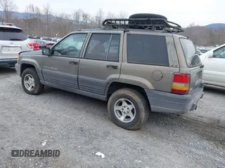 1996 Jeep Grand Cherokee with VIN 1J4EZ58S1TC112995, listed as a IAAI auction lot 41706966 with 356,727 mi miles and . Bid and sale history available at DreamBid. Image 3.
