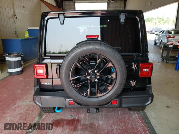 2023 Jeep Wrangler Sahara with VIN 1C4JJXP65PW627241, listed as a Copart auction lot 62873313 with 9,219 mi miles and Clean Title. Bid and sale history available at DreamBid. Image 6.