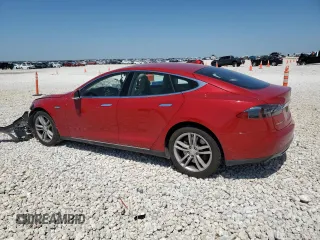 2013 Tesla Model S with VIN 5YJSA1CN1DFP26864, listed as a Copart auction lot 52029485 with 63,260 mi miles and Salvage Title. Bid and sale history available at DreamBid. Image 2.