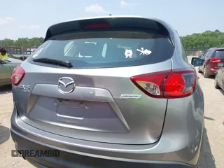 2014 Mazda CX-5 Sport with VIN JM3KE4BE9E0411177, listed as a IAAI auction lot 42411938 with 167,709 mi miles and . Bid and sale history available at DreamBid. Image 16.