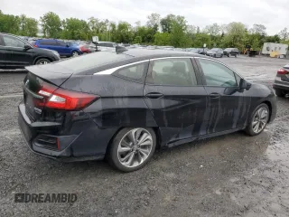 2018 Honda Clarity Touring z VIN JHMZC5F38JC007547, wystawiony jako Copart lot #57199735 z przebiegiem 176 149 mil mil oraz Czysty tytuł • Clean title. Historia ofert i sprzedaży dostępna na DreamBid. Obrazek 3.