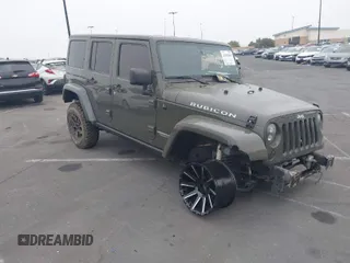 2015 Jeep Wrangler Unlimited Rubicon Hard Rock with VIN 1C4HJWFG3FL704787, listed as a IAAI auction lot 42002960 with 149,887 mi miles and . Bid and sale history available at DreamBid. Image 1.