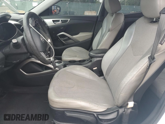 2012 Hyundai Veloster w/Black Int z VIN KMHTC6AD1CU030478, wystawiony jako Copart lot #62715005 z przebiegiem 127 625 mil mil oraz Szkoda całkowita • Salvage title. Historia ofert i sprzedaży dostępna na DreamBid. Obrazek 7.