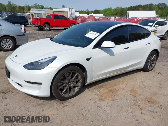 2021 Tesla Model 3 Standard Range Plus z VIN 5YJ3E1EA9MF027985, wystawiony jako IAAI lot #42045254 z przebiegiem 42 353 mil mil oraz . Historia ofert i sprzedaży dostępna na DreamBid. Obrazek 2.