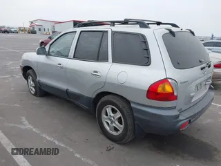 2003 Hyundai Santa Fe LX with VIN KM8SC73E83U568666, listed as a IAAI auction lot 41679044 with 127,560 mi miles. Bid and sale history available at carsss.com. Image 3.