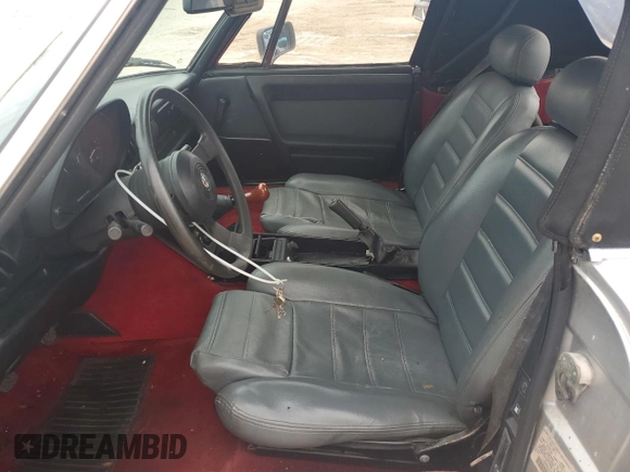 1990 Alfa Romeo Spider z VIN ZARBA12T0L6002373, wystawiony jako Copart lot #75362404 z przebiegiem 73 479 mil mil oraz Nie do naprawy • Non repairable. Historia ofert i sprzedaży dostępna na DreamBid. Obrazek 7.