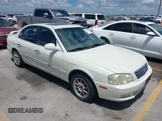 2002 Kia Optima LX z VIN KNAGD126325144218, wystawiony jako IAAI lot #42596691 z przebiegiem 220 972 mil mil oraz . Historia ofert i sprzedaży dostępna na DreamBid. Obrazek 1.
