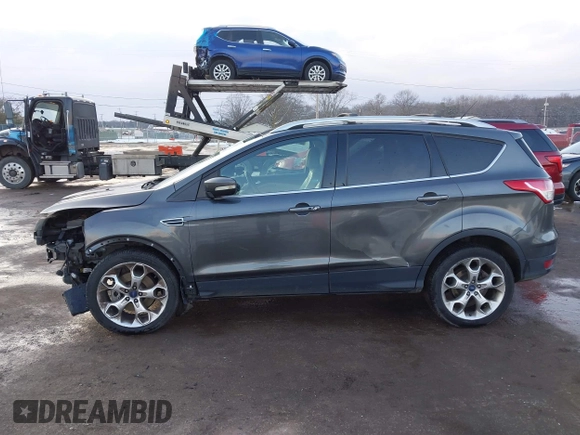 2015 Ford Escape Titanium with VIN 1FMCU0J92FUB74972, listed as a IAAI auction lot 41164519 with 228,785 mi miles and . Bid and sale history available at DreamBid. Image 14.