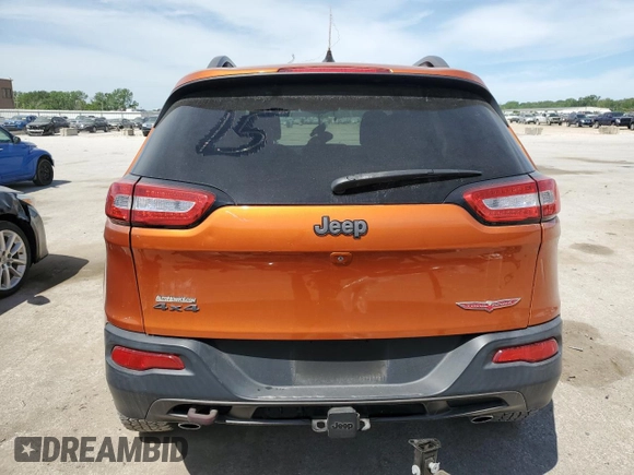 2015 Jeep Cherokee Trailhawk with VIN 1C4PJMBS5FW523019, listed as a Copart auction lot 55527955 with 107,503 mi miles and Salvage title. Bid and sale history available at DreamBid. Image 6.