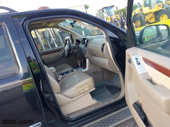 2012 Nissan Pathfinder LE with VIN 5N1AR1NN5CC607403, listed as a IAAI auction lot 41813677 with 217,854 mi miles. Bid and sale history available at carsss.com. Image 5.